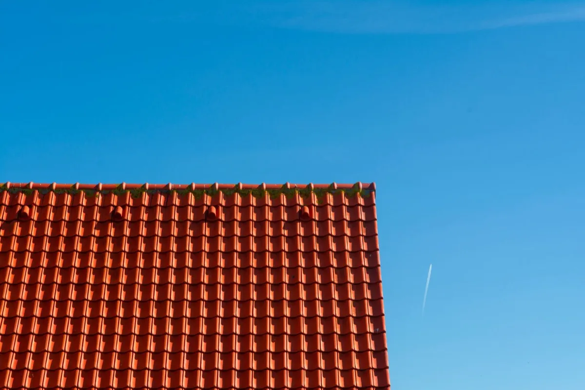 Tile roof gable in full sun, the kind of exposure that sets roof life in Topeka, KS